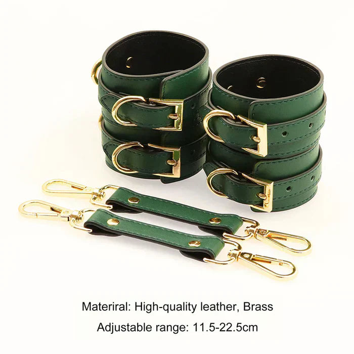 Green wrist and ankle restraints laid out on white background